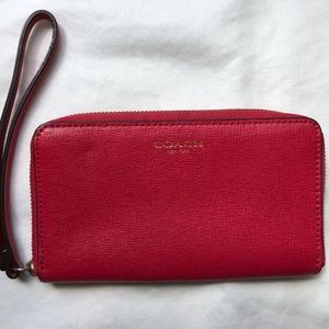 COACH Pink wristlet wallet with zipper closure